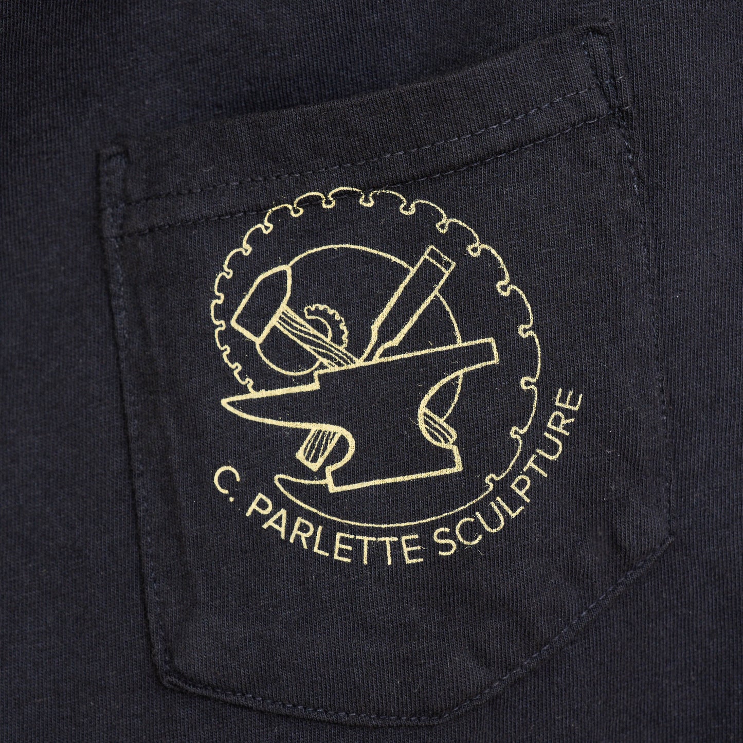 Embroidered logo on a black fabric with 'C. Parlette Sculpture' text.